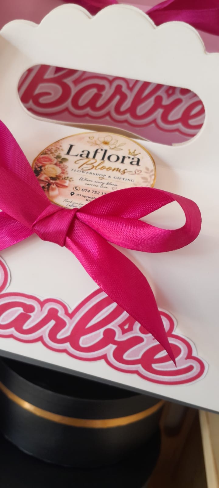 Barbie themed party treat box with a pink satin ribbon